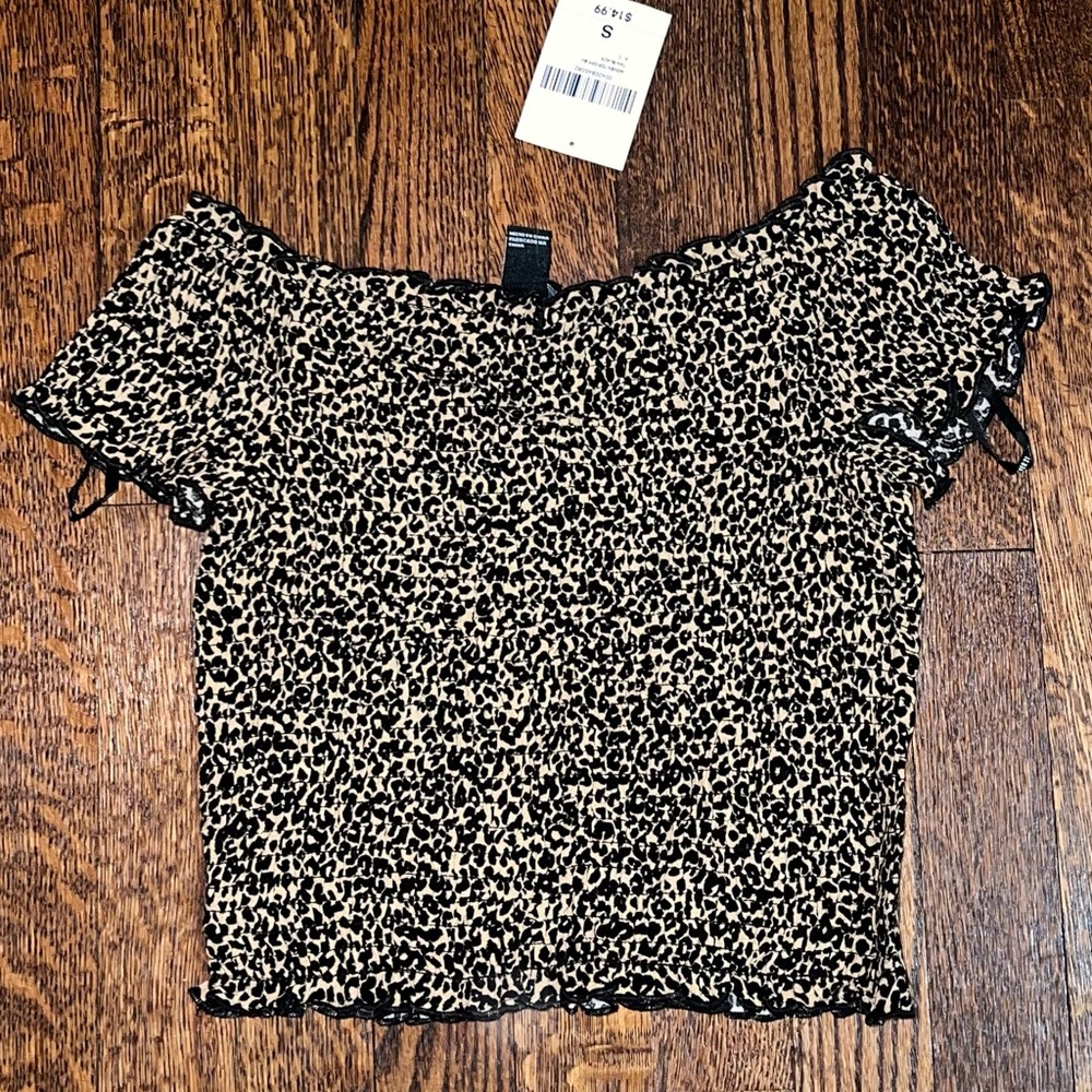 Forever 21, ruched off the shoulder formfitting crop top.
Super trendy and cute.